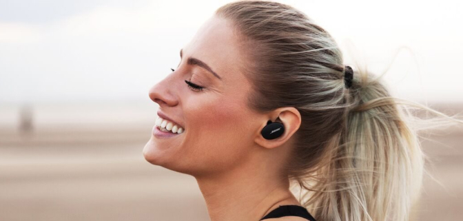 Woman with Bose earbuds